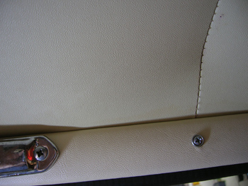 the bottom trim strip is the reproduction, and is a very close match